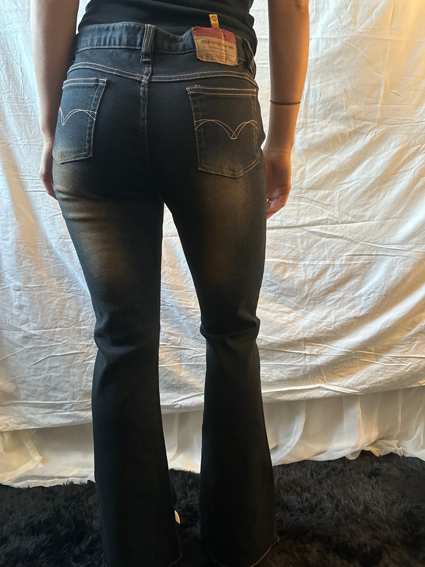Dark denim jeans with orange flower