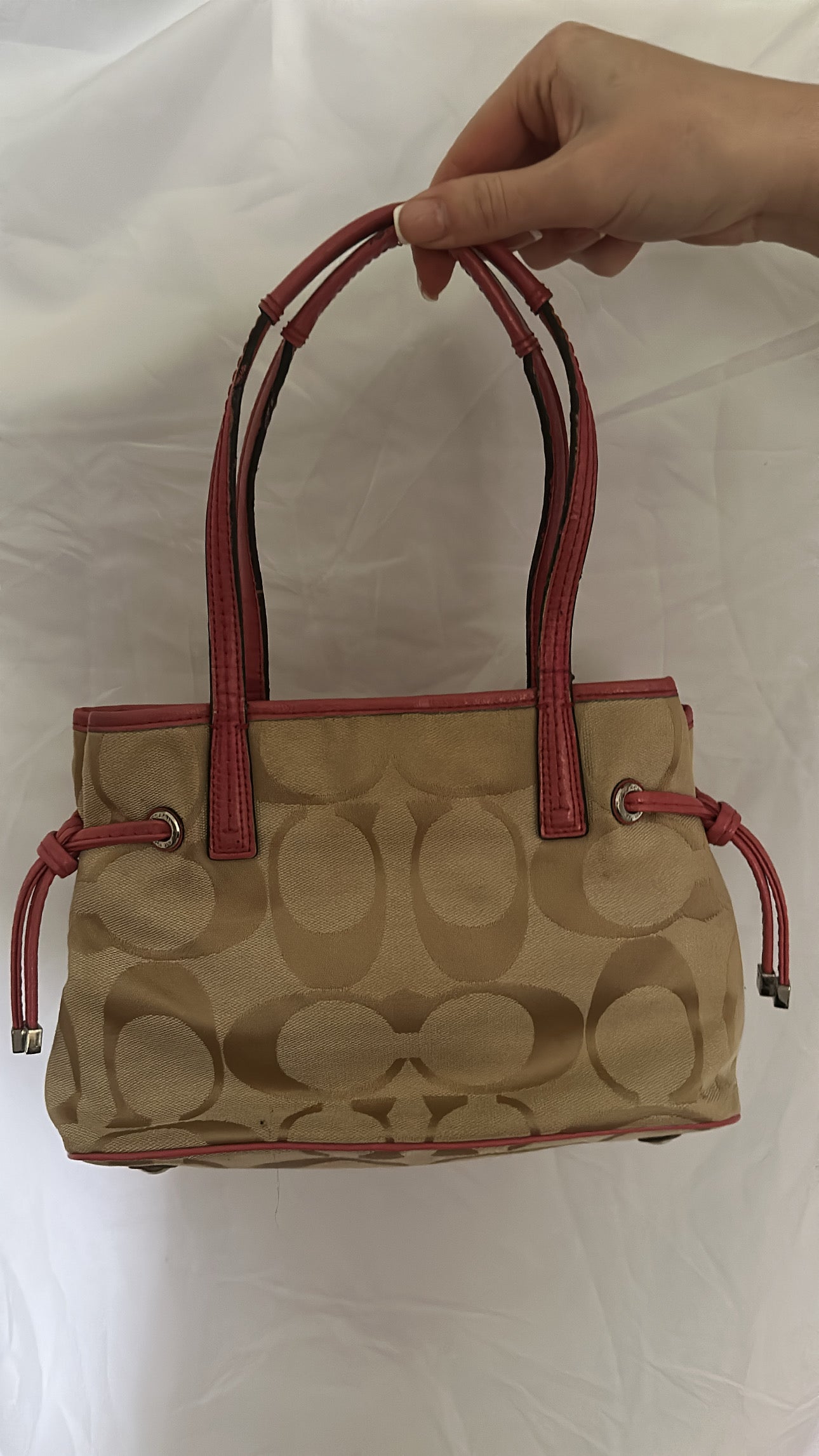 Coach bag with pink strap