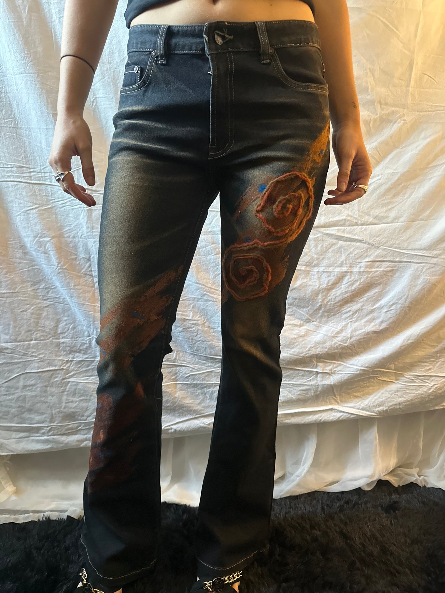 Dark denim jeans with orange flower