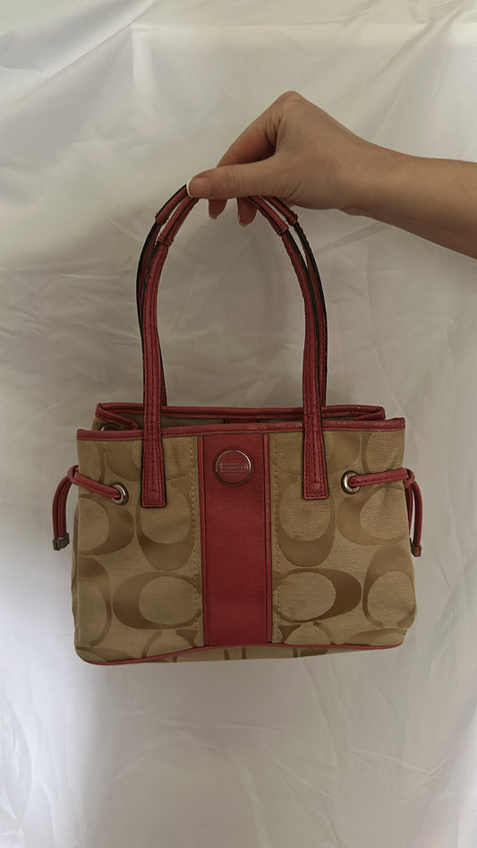 Coach bag with pink strap