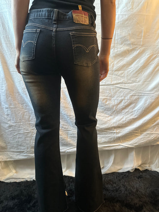 Dark denim jeans with orange flower