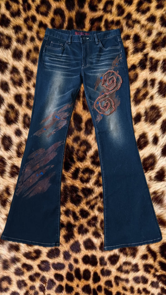 Dark denim jeans with orange flower